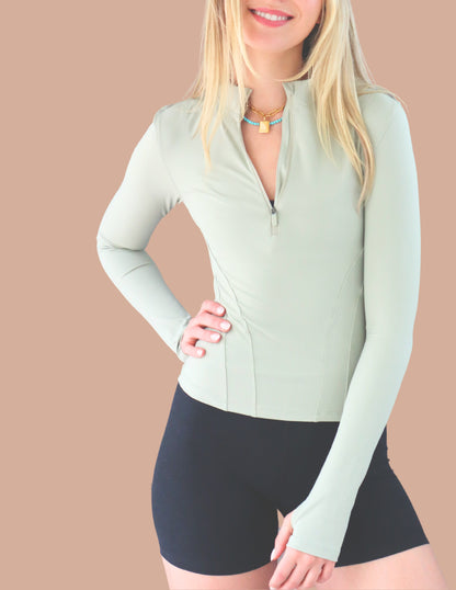 The Belle, UPF 50+ mid-cropped half zip in Spring Mint & Midnight Black