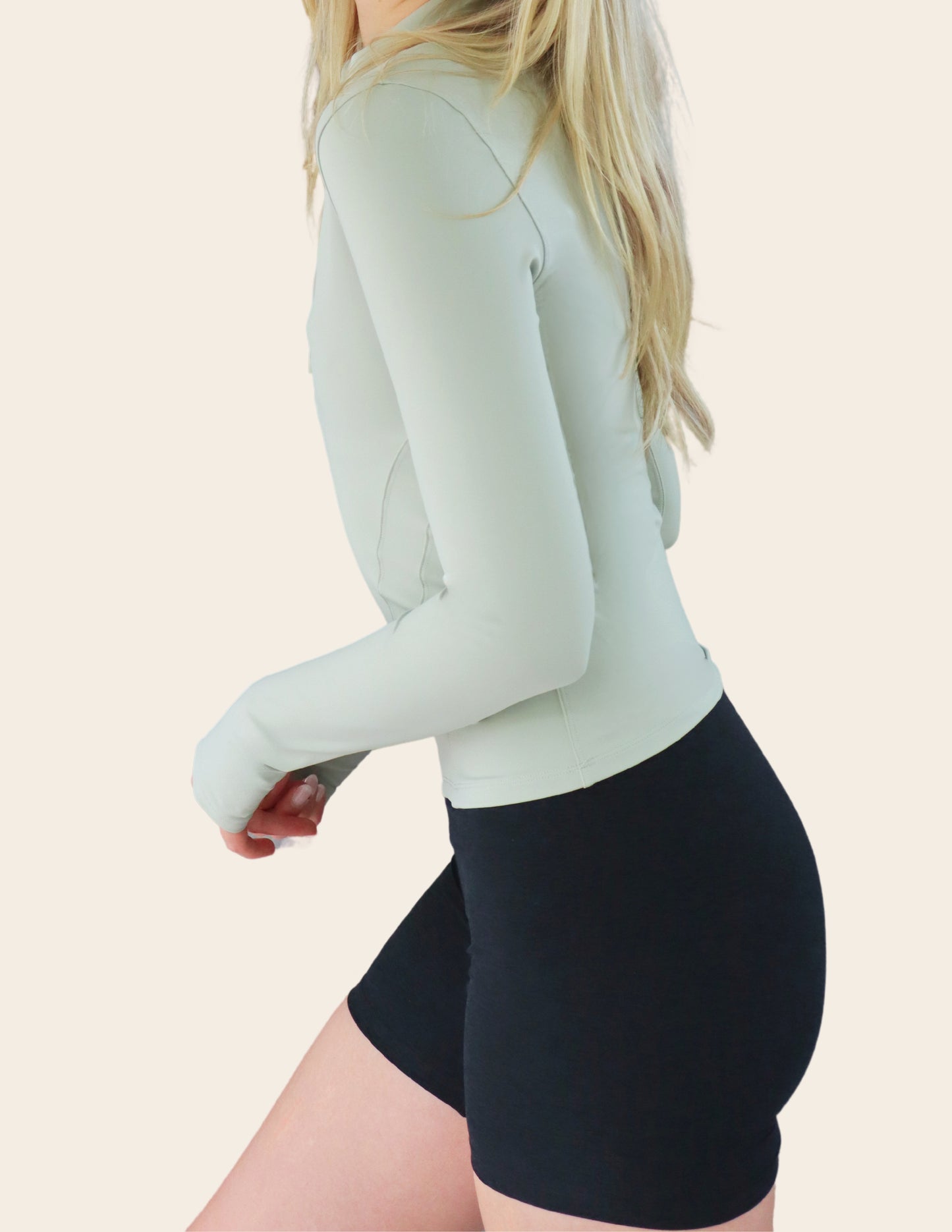 The Belle, UPF 50+ mid-cropped half zip in Spring Mint & Midnight Black